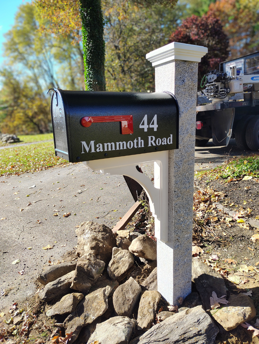 Stone Mailbox Post with white bracket, black mailbox, and custom white address decals