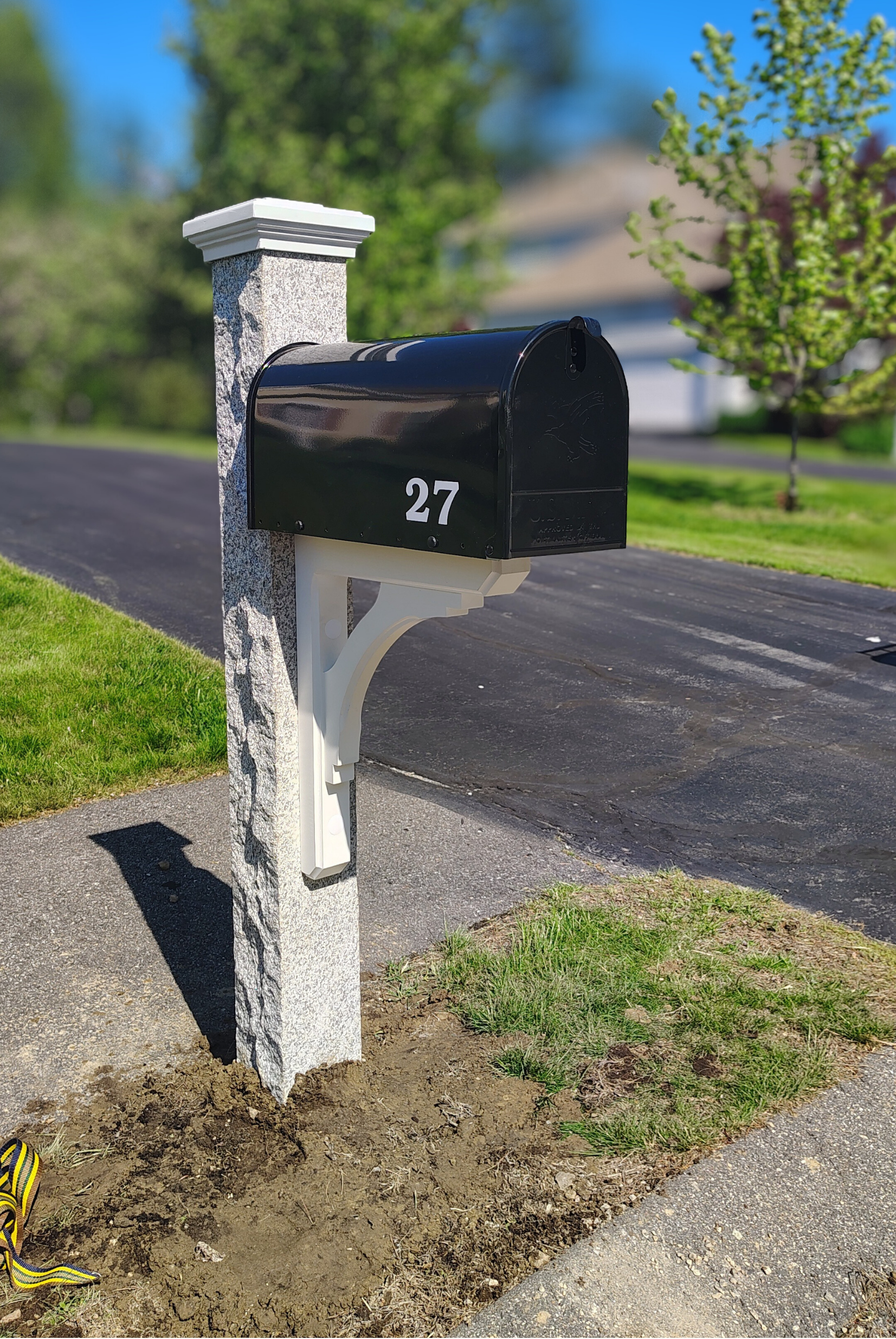 6x6 granite post with white wood bracet matching white cap and a black gibraltar mailbox installed in westford ma