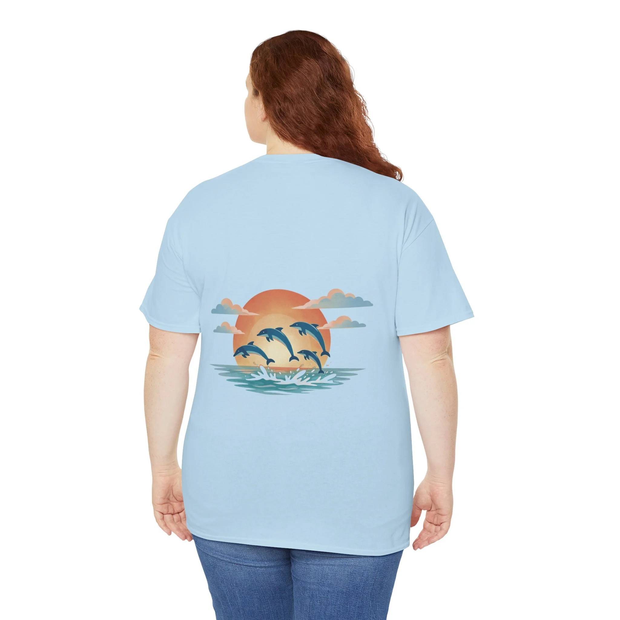 Light blue t-shirt with dolphins swimming at sunset graphic inspired by the ocean and Western Australia coastline.