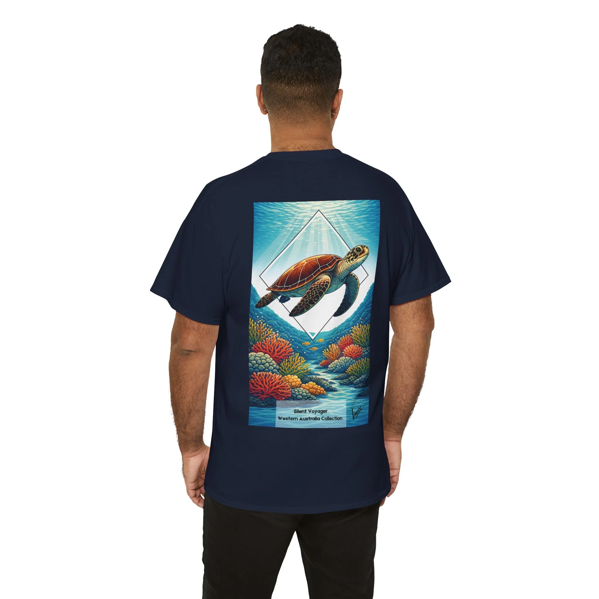 Navy blue t-shirt featuring sea turtle swimming over coral reef inspired by Australian ocean wildlife.