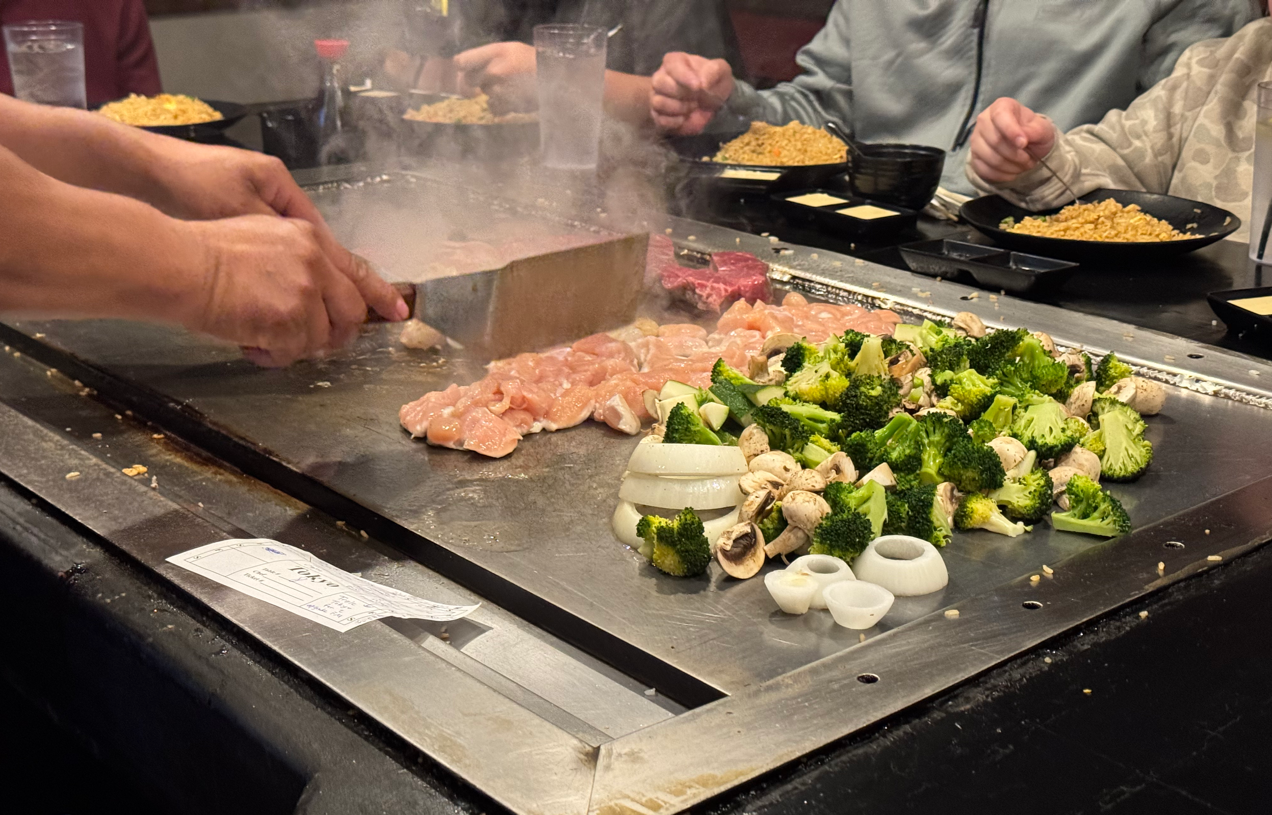 Tokyo Japanese Steakhouse hibachi grill with filet mignon, steak, chicken, and vegetables