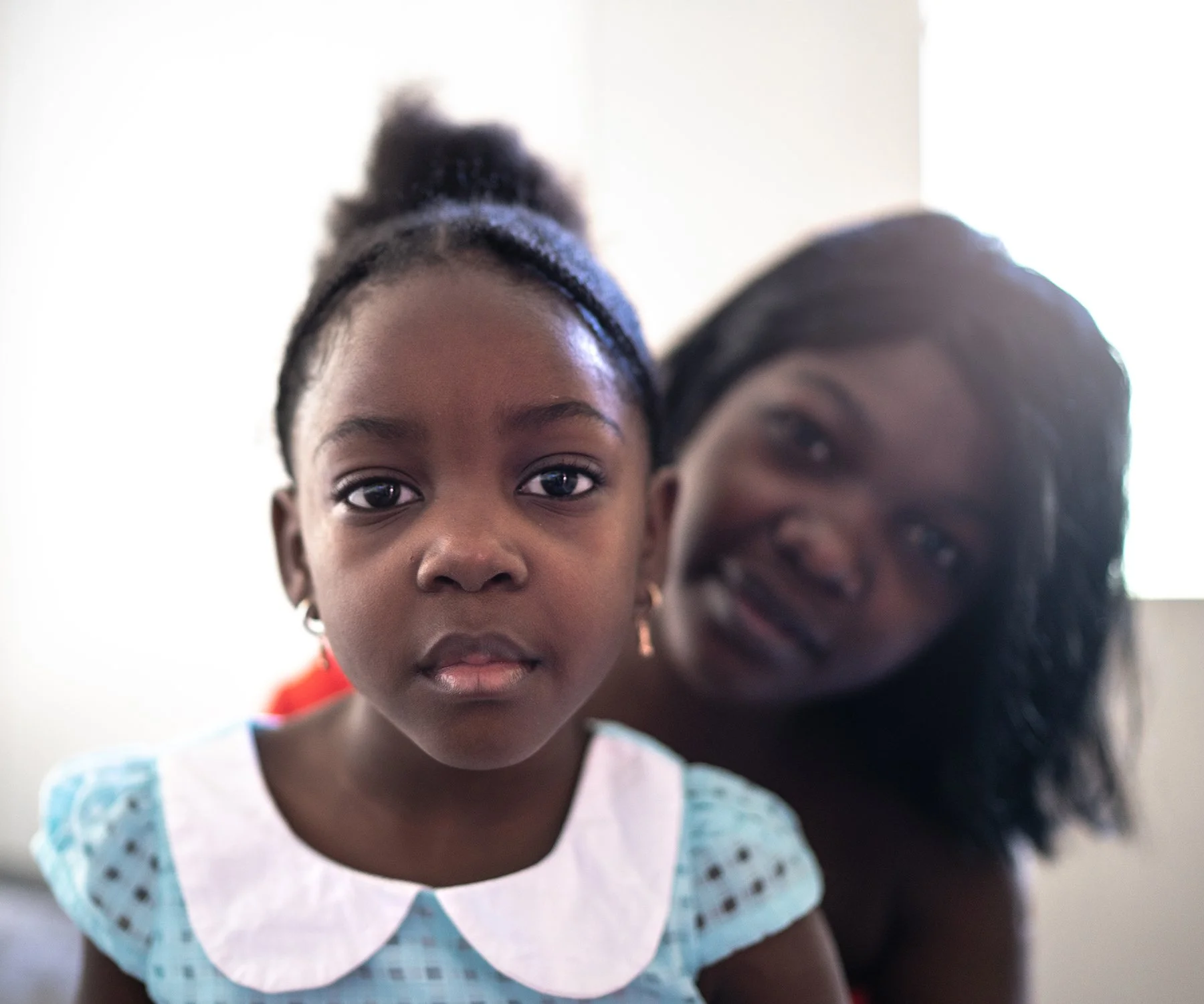 Portrait of mother and young daughter