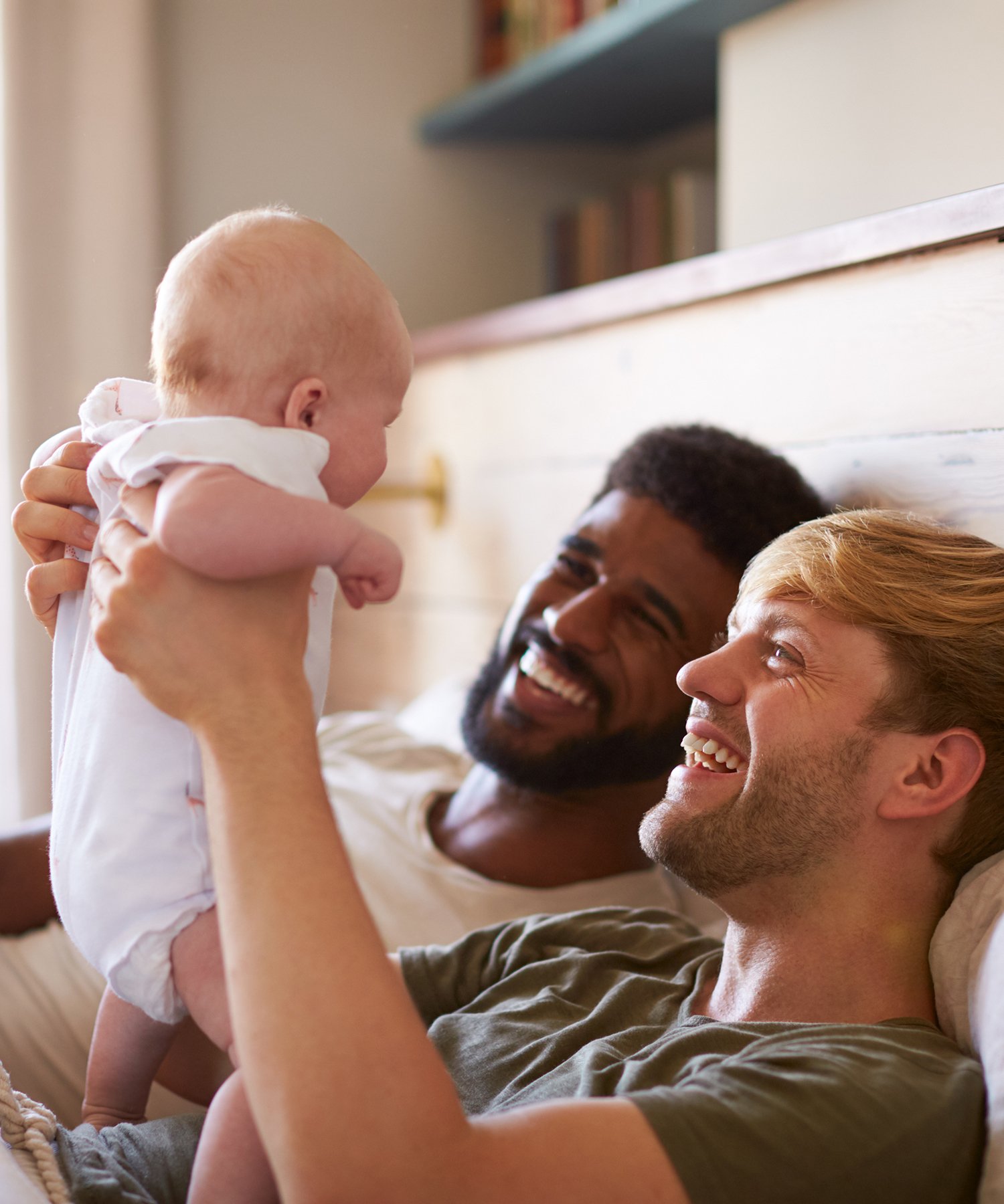 Two parents, one is holding their baby.