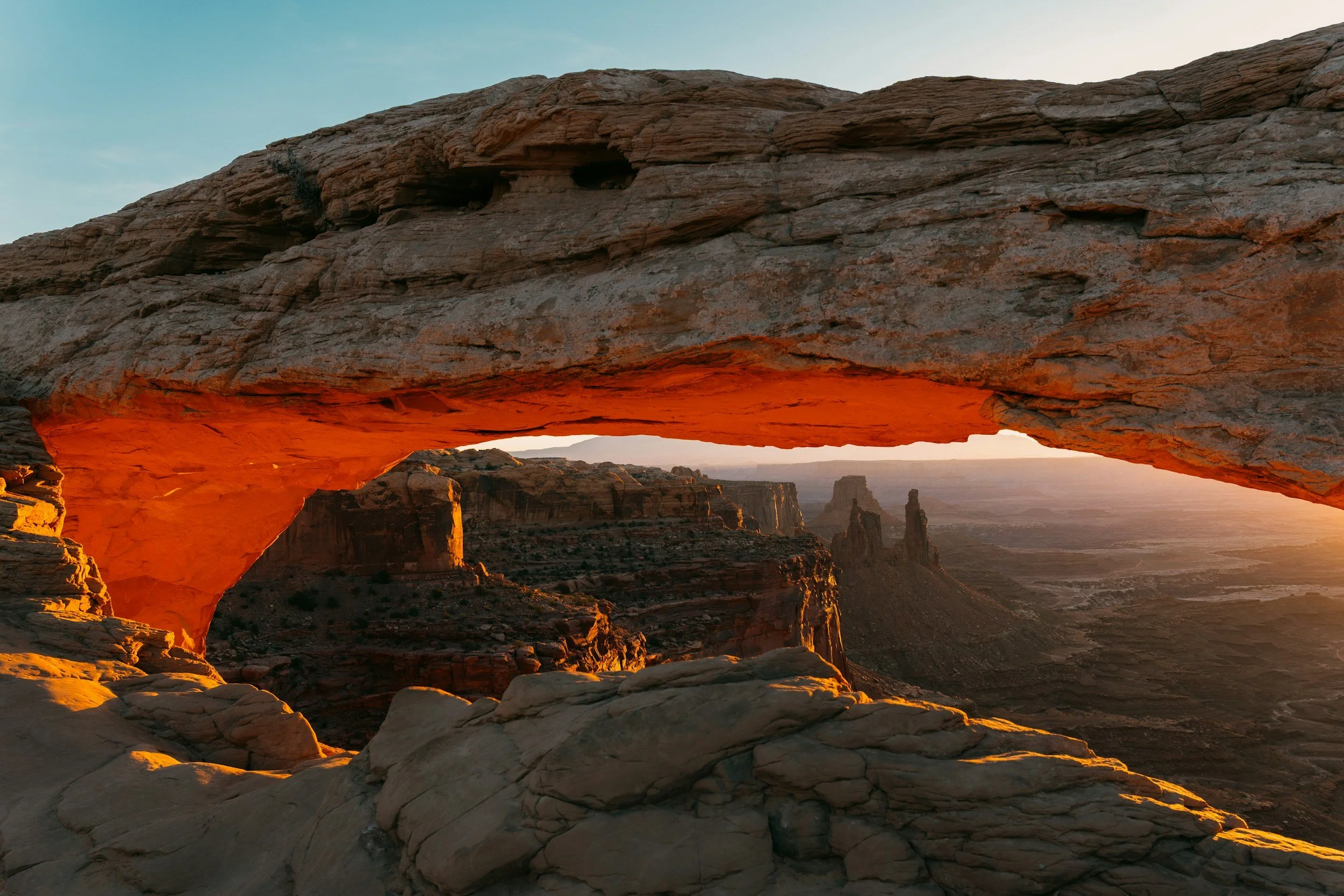 Rock arch in the desert lit by the sun