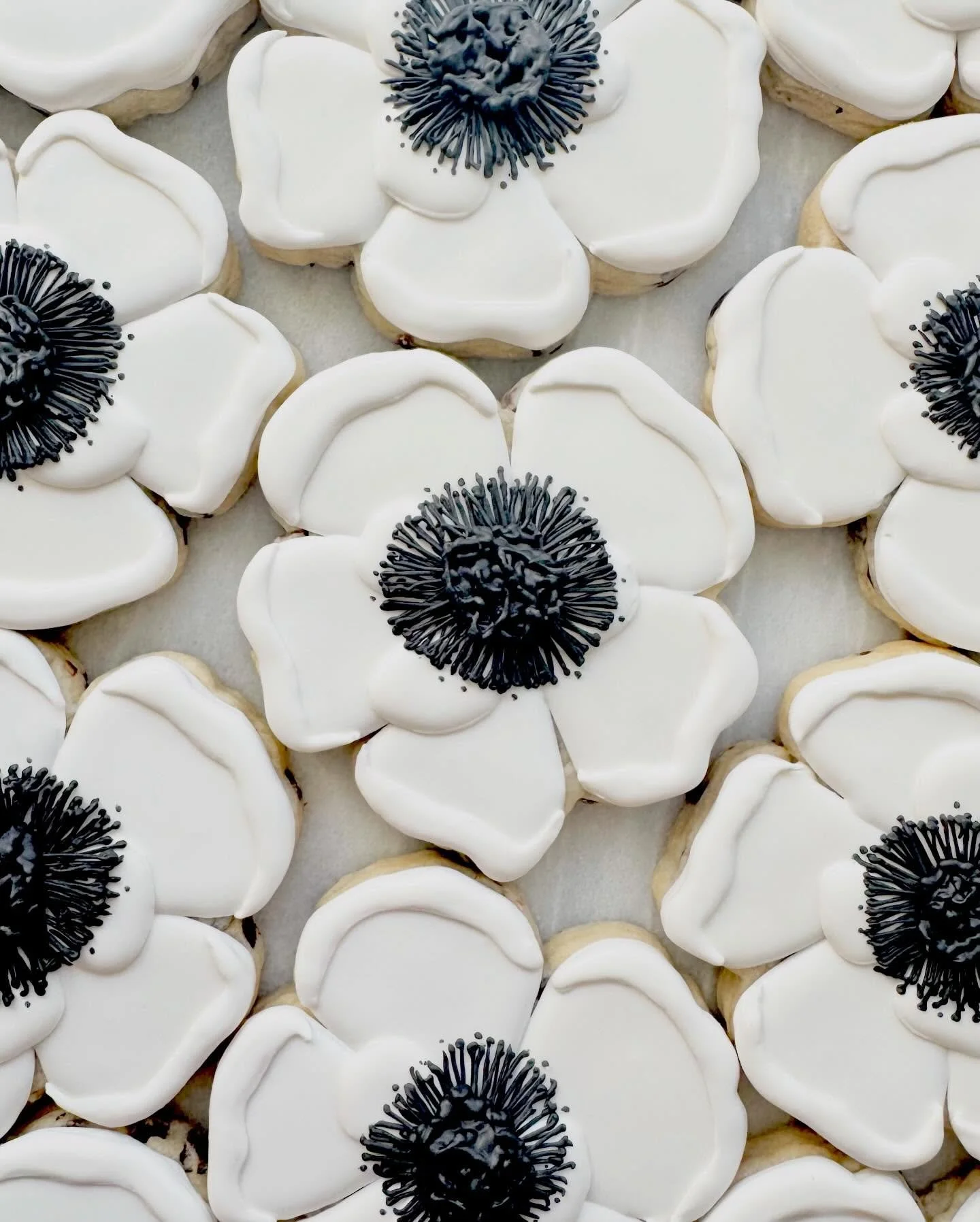 The anemones deserved their own moment 🖤
&bull;
&bull;
&bull;
#IcedByAnna
#CustomSugarCookies
#WestHartfordCT
#WeddingCookies
#RoyalIcingCookies