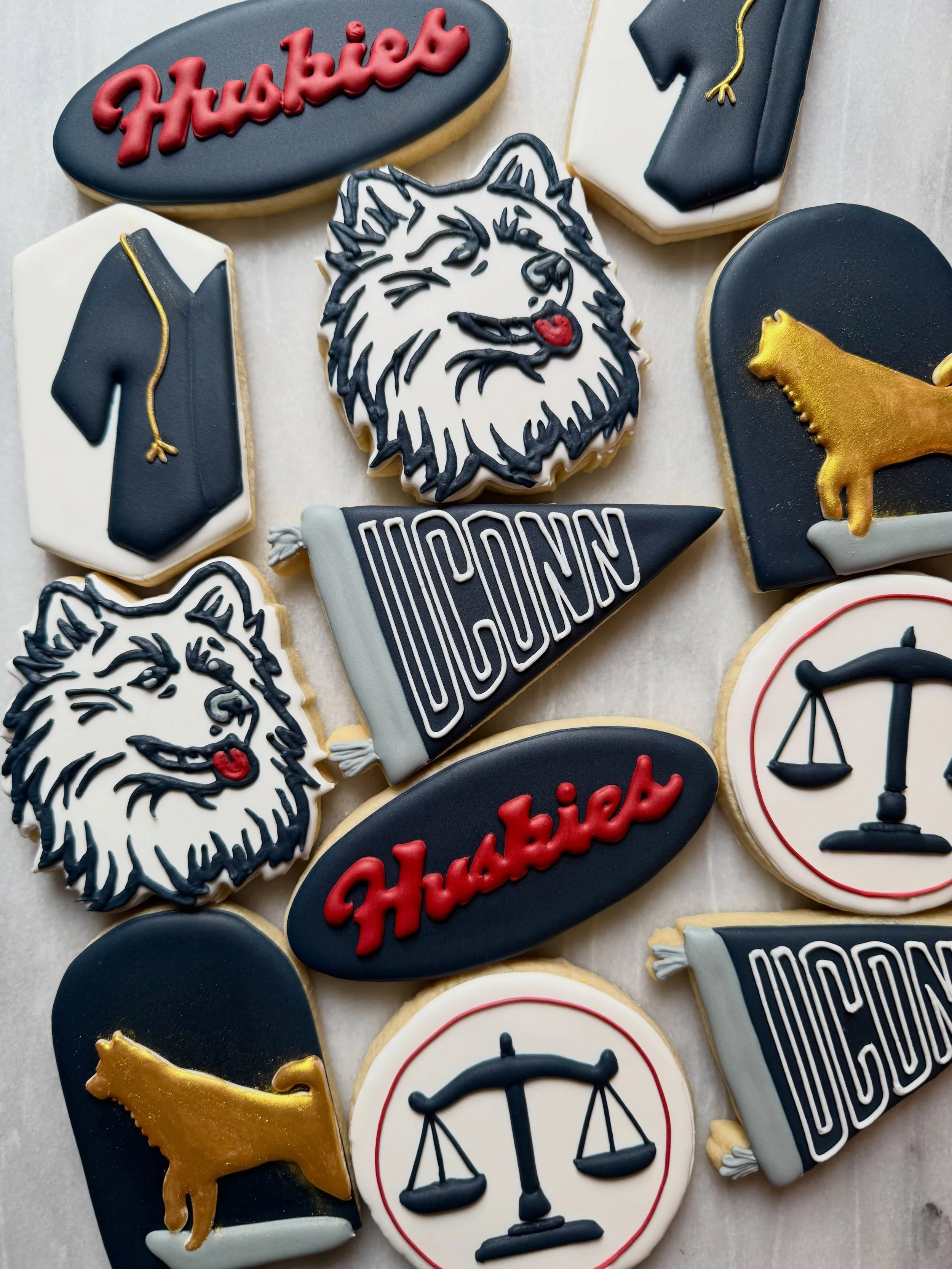Graduation season in full swing ✨🎓
&bull;
&bull;
&bull;
#IcedByAnna
#CustomSugarCookies
#GraduationCookies
#UConn
#RoyalIcingCookies