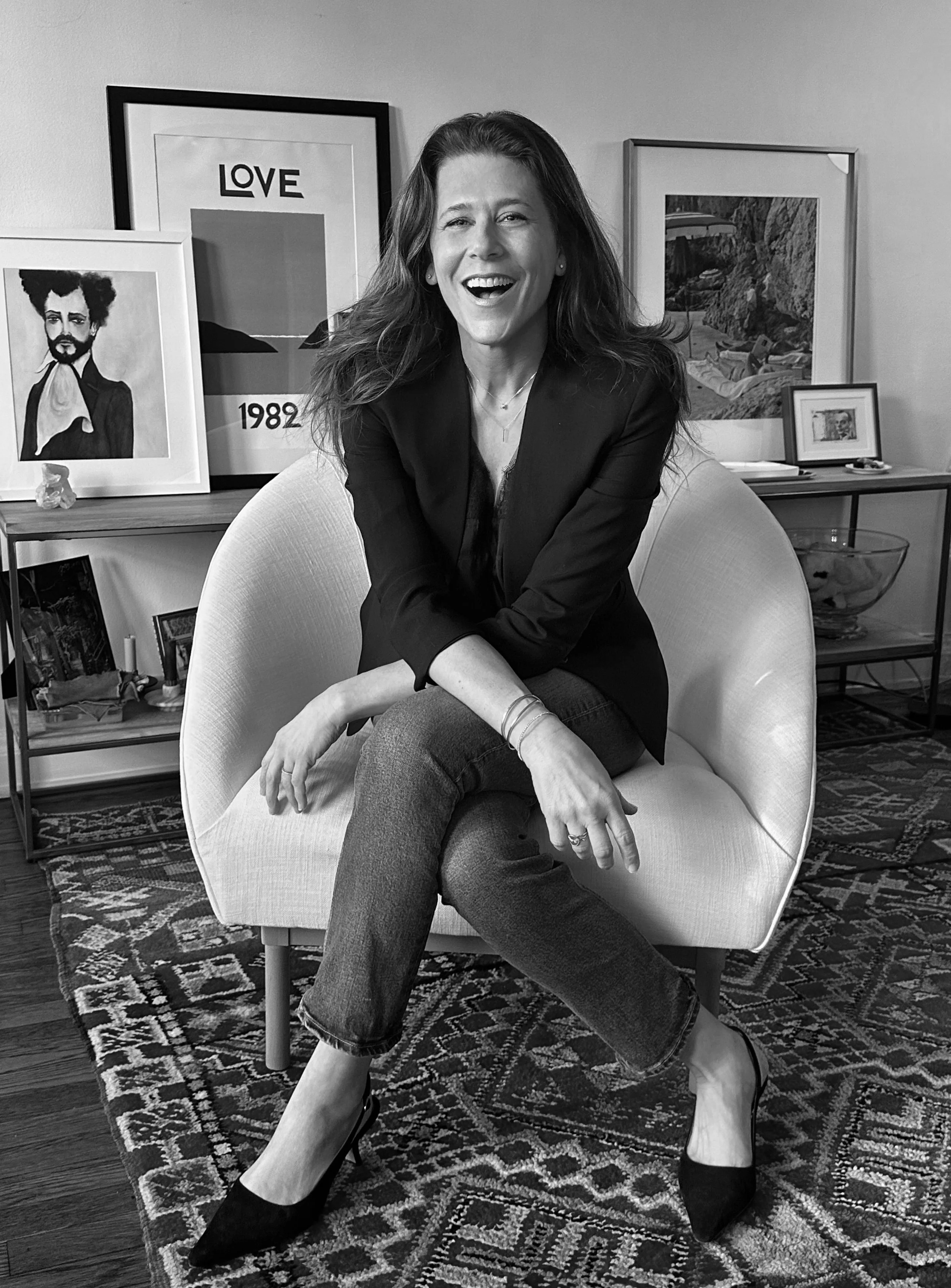 Agency founder, producer, and on-air personality Carrie Waible seated in her home studio in New York City.