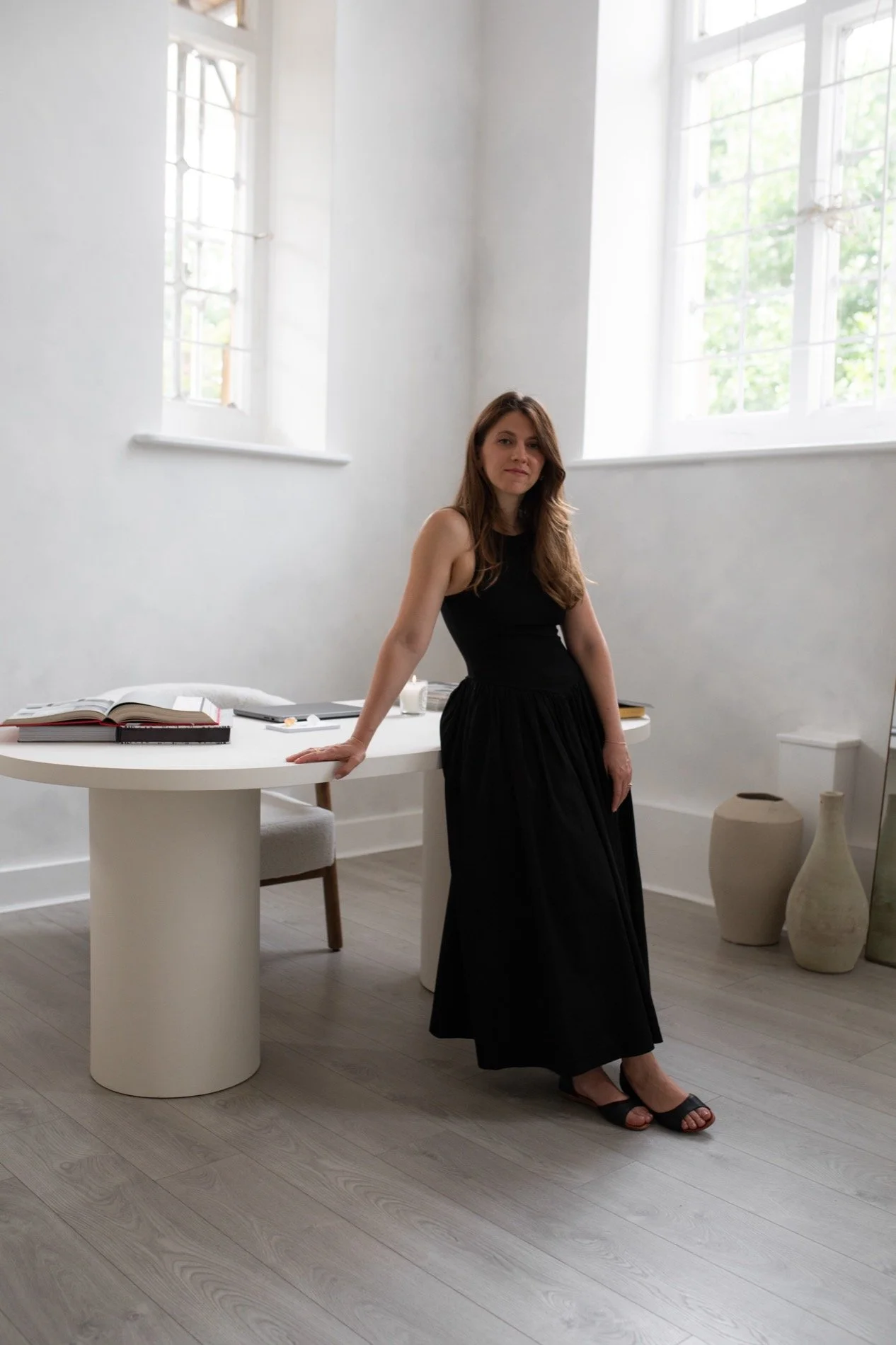 Wedding SEO specialist Nergis standing in front of her desk