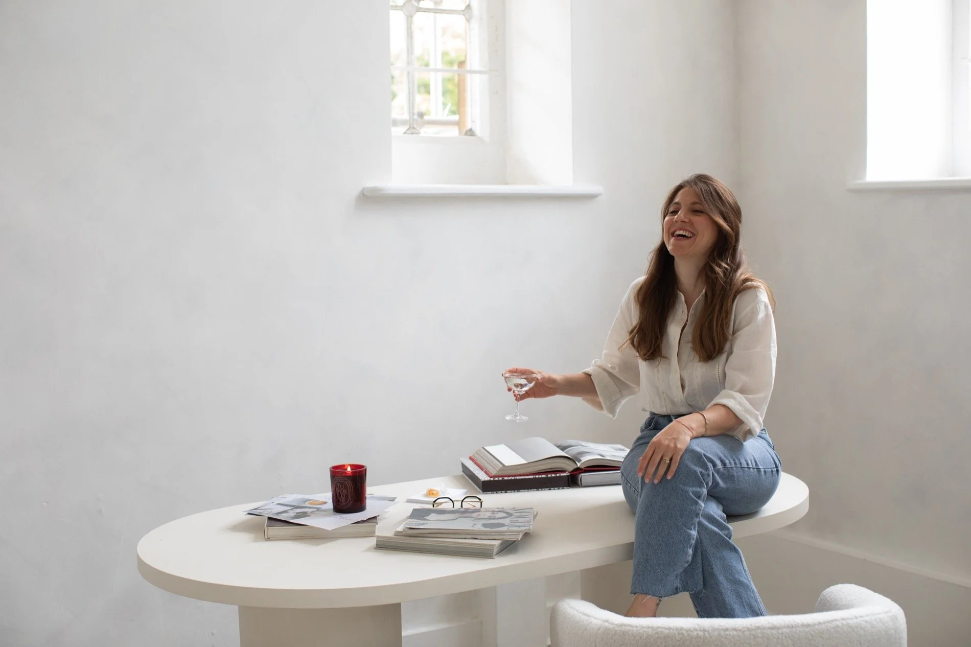 Nergis celebrating a client's SEO success with a glass of drink