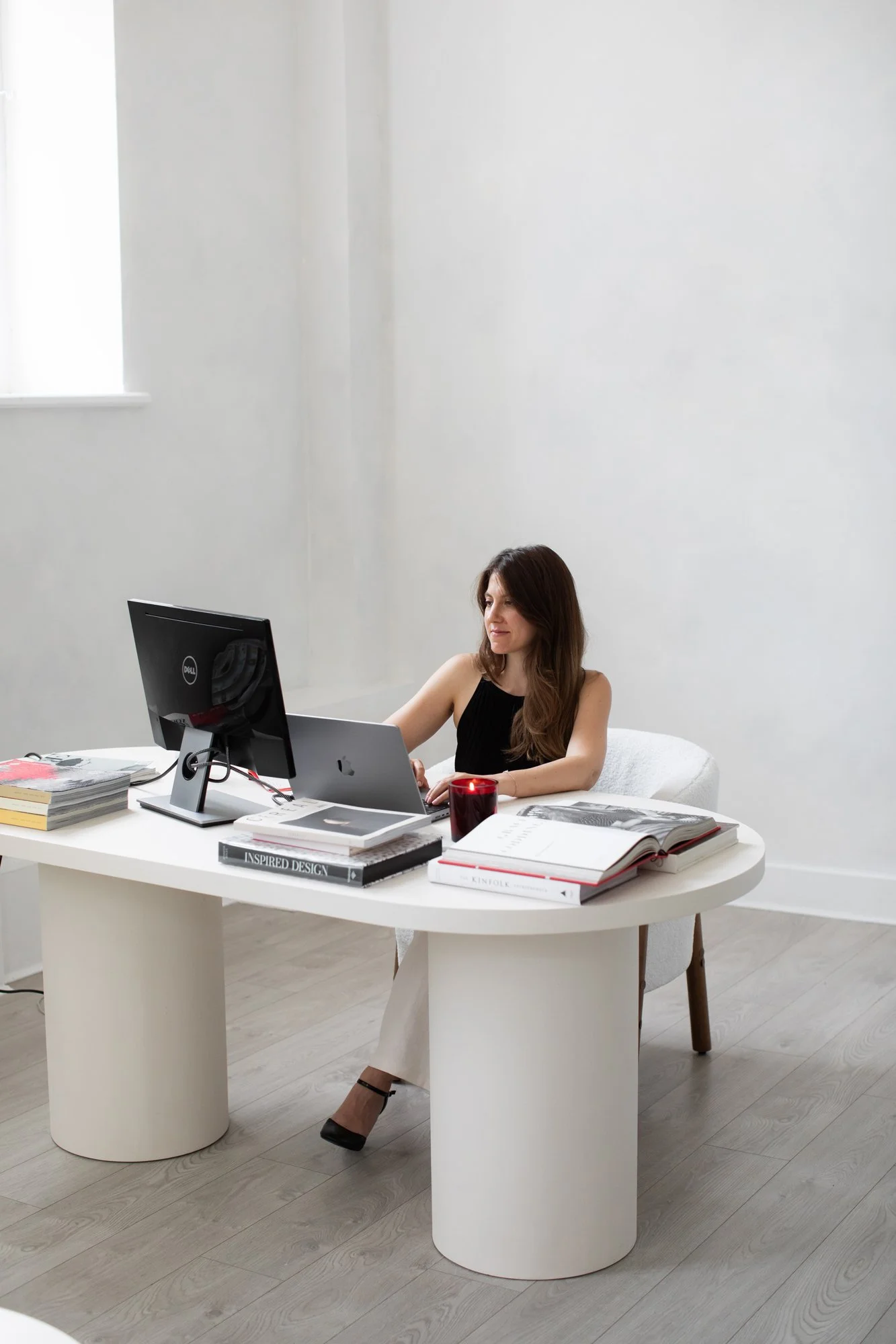 Nergis Yuksel, a wedding seo specialist, working on her laptop delivering a wedding seo service