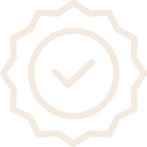 A badge with a checkmark inside a circle, surrounded by a scalloped border.