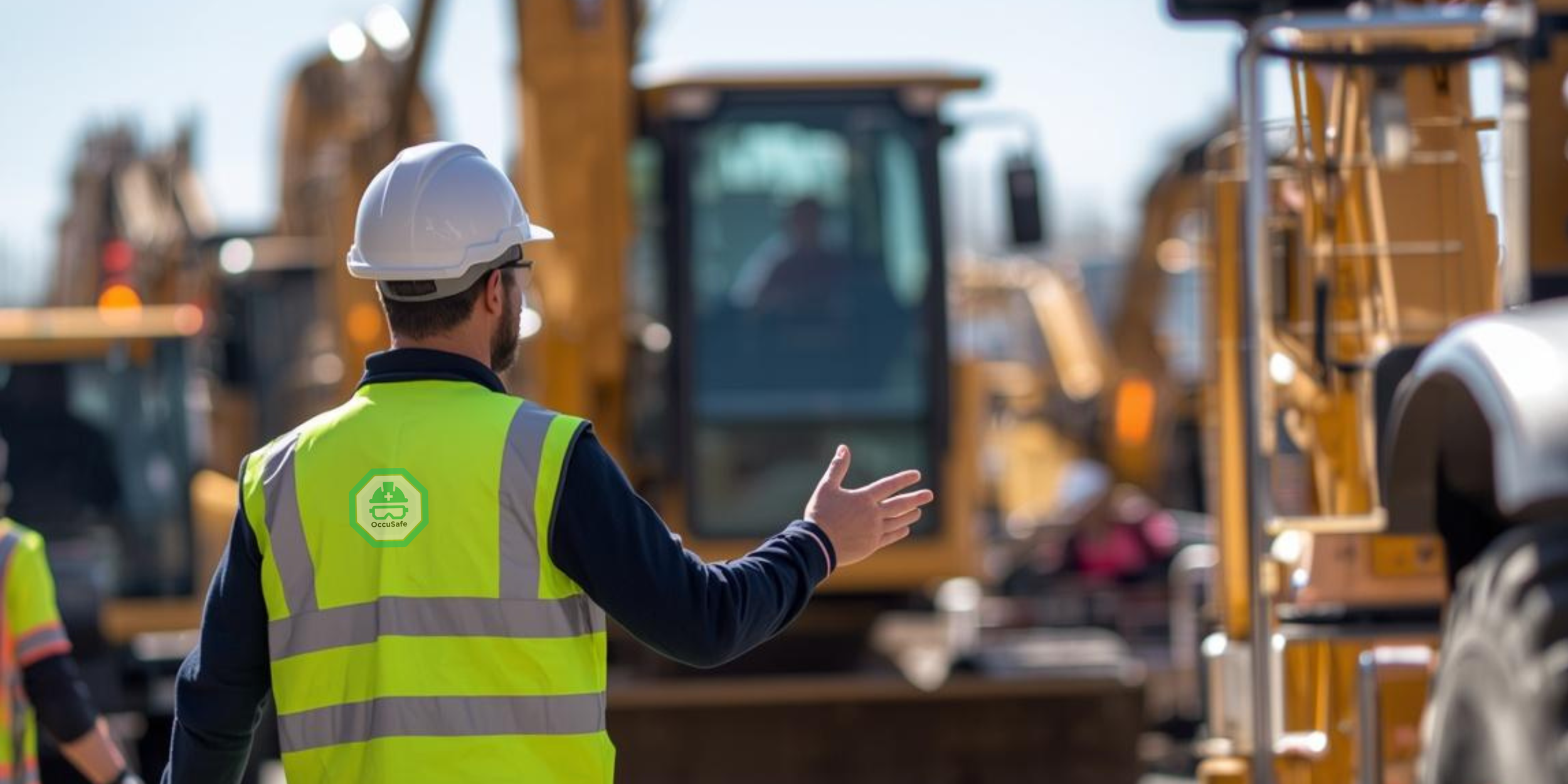A construction worker in a yellow safety vest and white hard hat gives instructions near construction machinery, with other workers in the background.