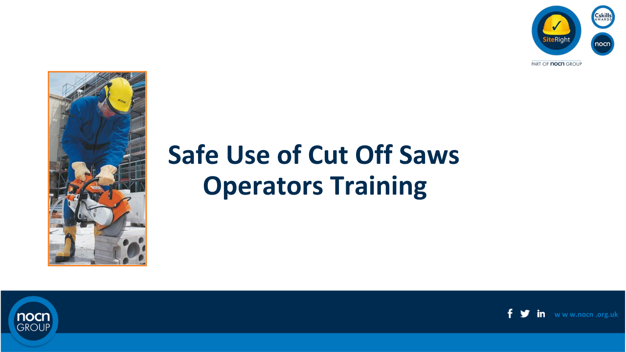 A worker in safety gear using a cut-off saw on a construction site.
