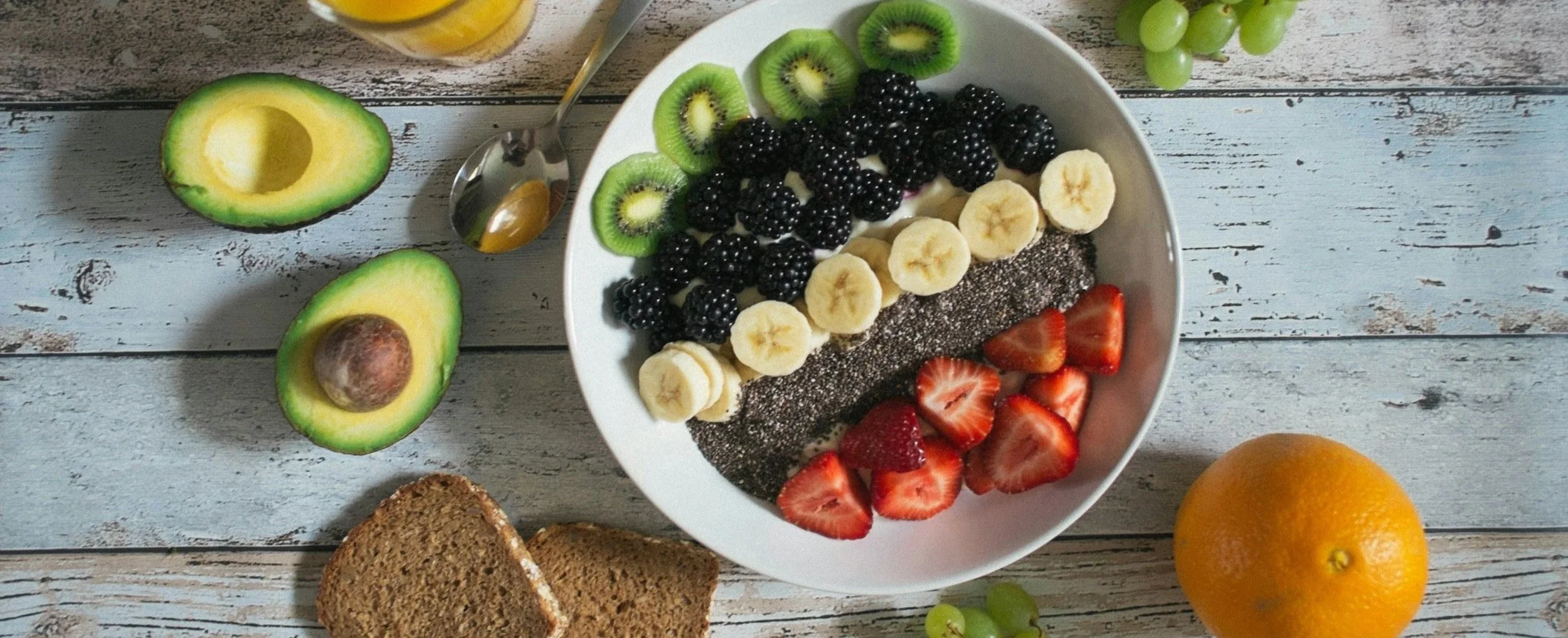 fiber rich breakfast bowl with berries banana kiwi and chia seeds