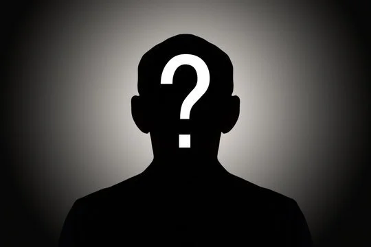 Silhouette of a person with a question mark on their face in front of a dark gray gradient background.