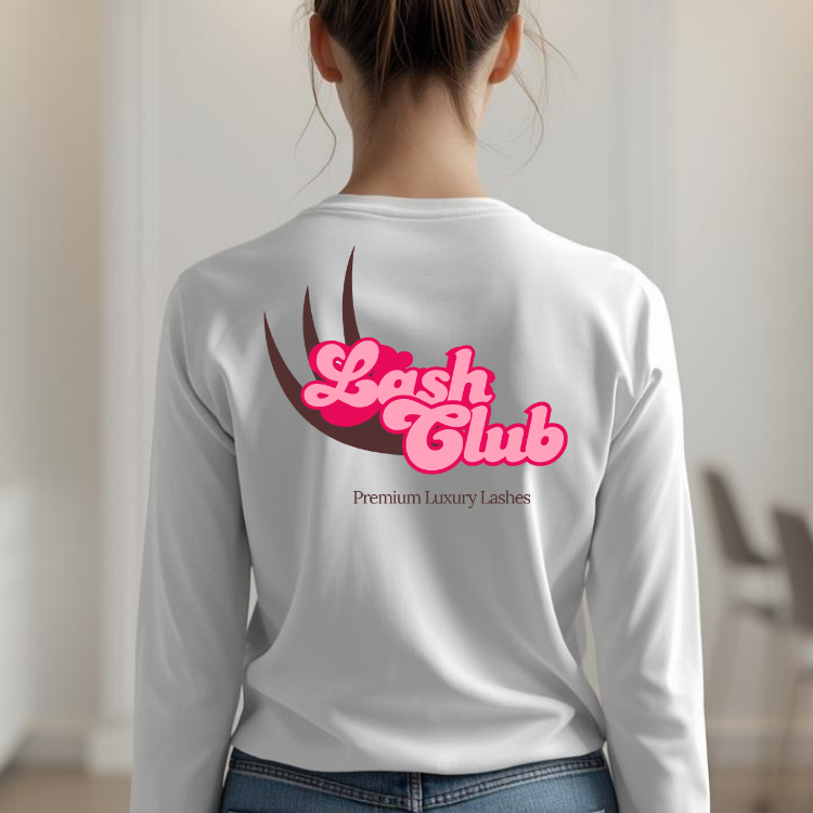 Back of a woman wearing a white shirt with a logo that says 'Lash Club' in pink and brown with an eyelash graphic, and the text 'Premium Luxury Lashes' underneath.