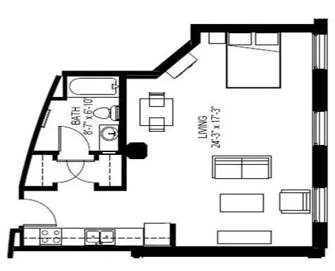 Floor plan of a small apartment showing a bedroom, living room, kitchen, and bathroom.
