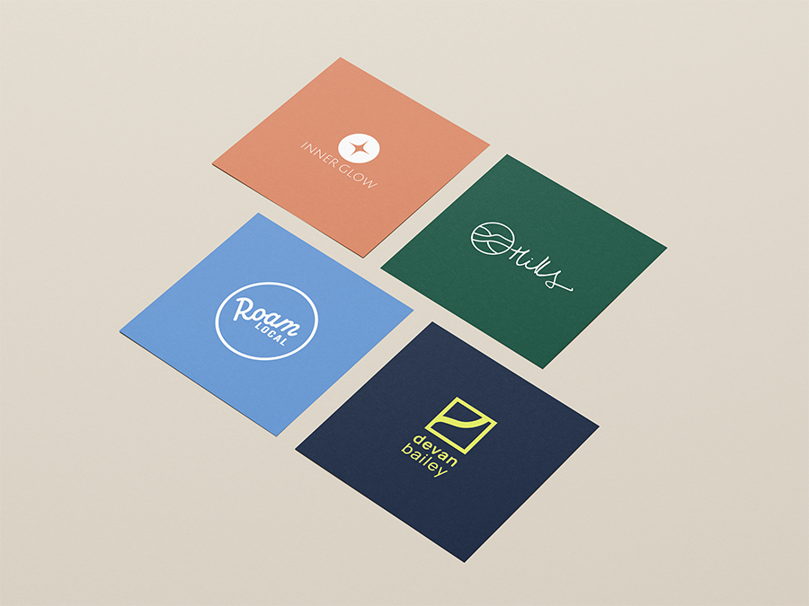 Four colorful cards with logos and text, arranged in a square on a light background. The cards display various brand or organization names and symbols.