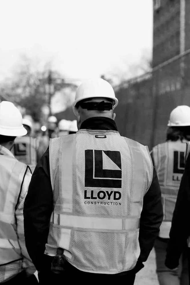 Lloyd construction worker in hardhat walking.