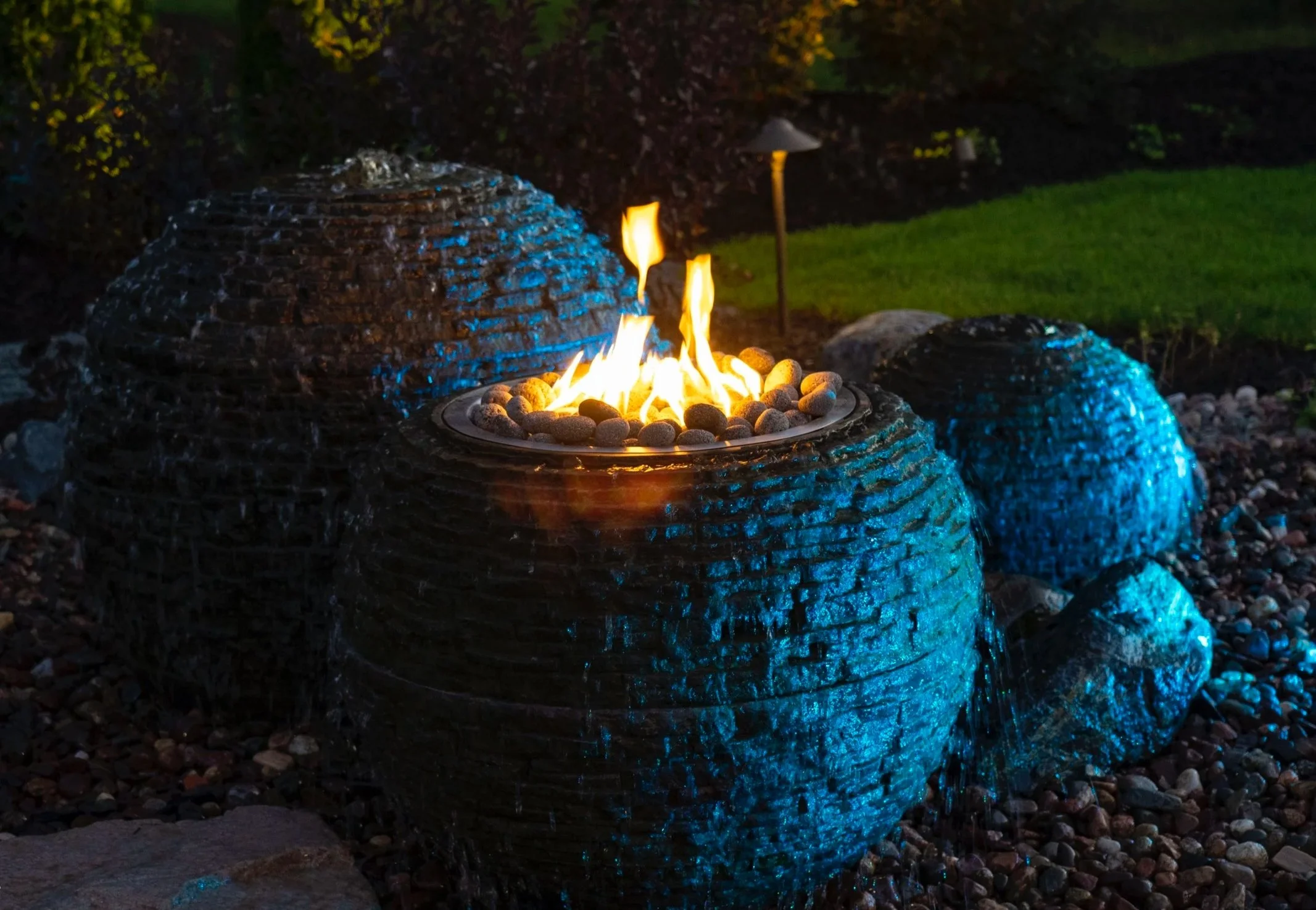 Rock round water feature with fire.