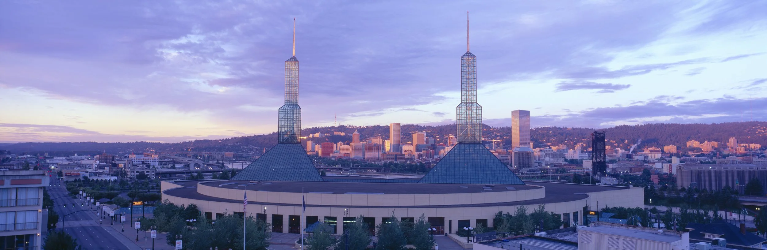 Portland Oregon skyline at dusk with Convention Center towers and downtown buildings