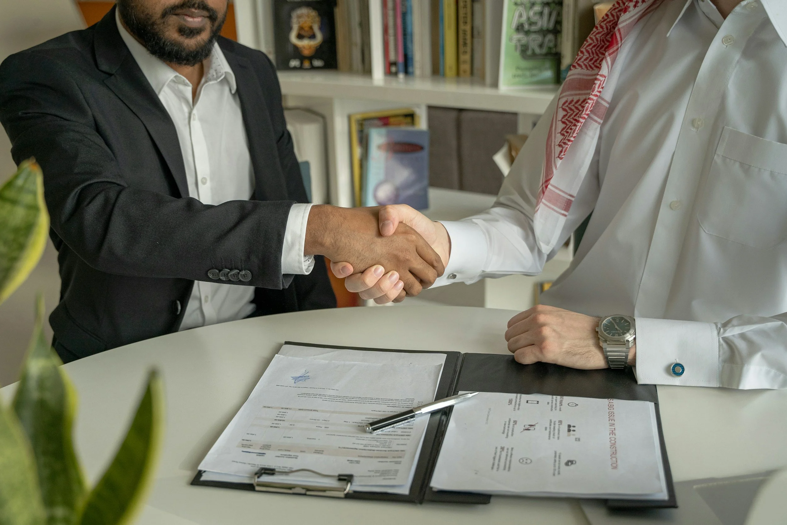Commercial real estate professionals reviewing a letter of intent document in a Portland office setting