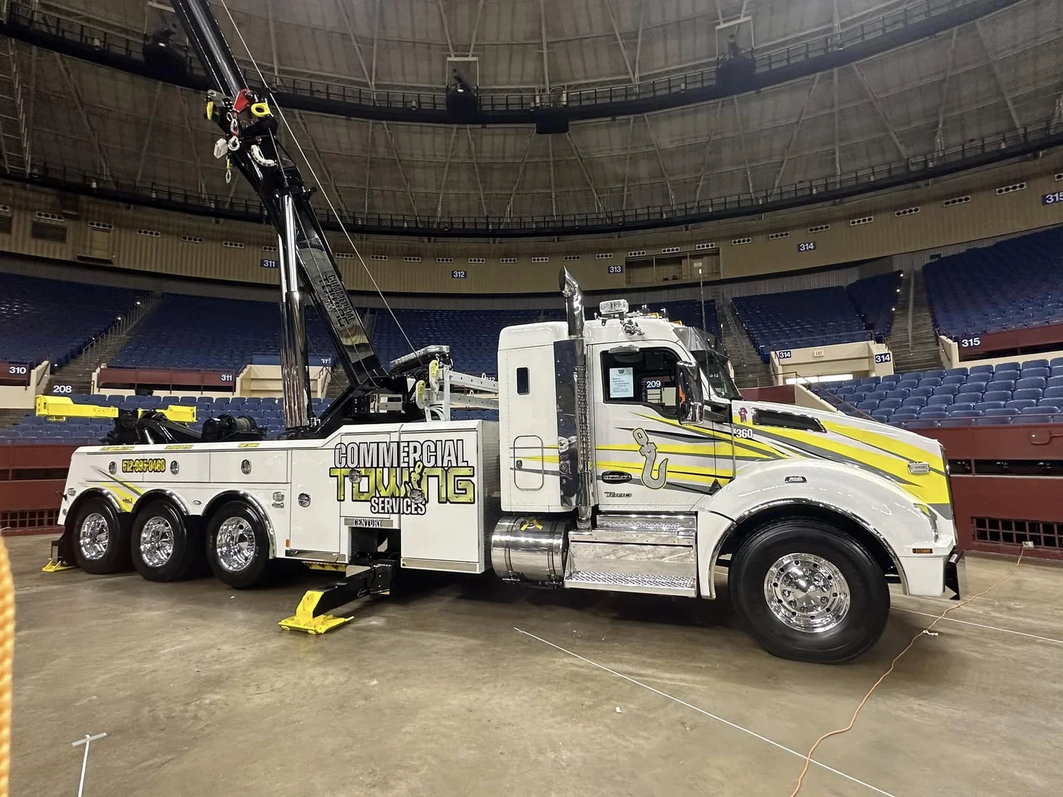 Commercial Road Solutions heavy-duty wrecker supporting a commercial tow