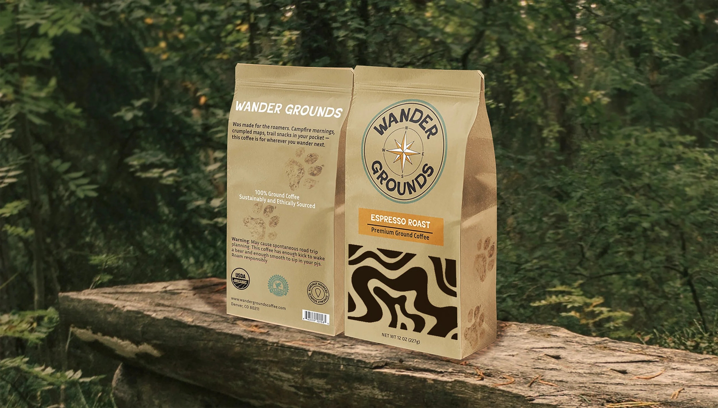 A brown paper bag of Wander Grounds espresso roast coffee placed on a lying tree log in a forest setting. A clear screen design on the bag allows the grounds to be seen from the outside.
