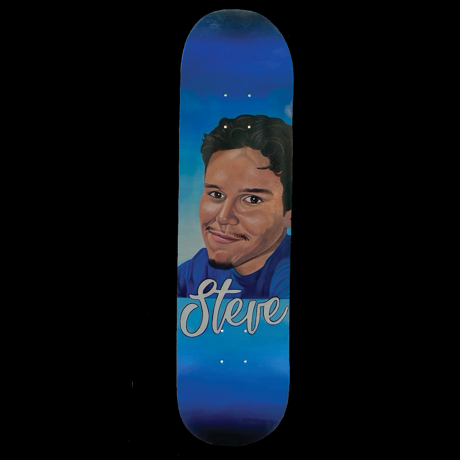 A skateboard with a painted portrait of a smiling young man with dark curly hair, wearing a blue shirt, and the name 'Steve' written in cursive on the deck. The background of the skateboard features a blue gradient, growing lighter inwards.