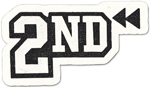 A sticker or patch with the text "2ND" in bold, black, block letters on a white background, with a black arrow pointing to the right.