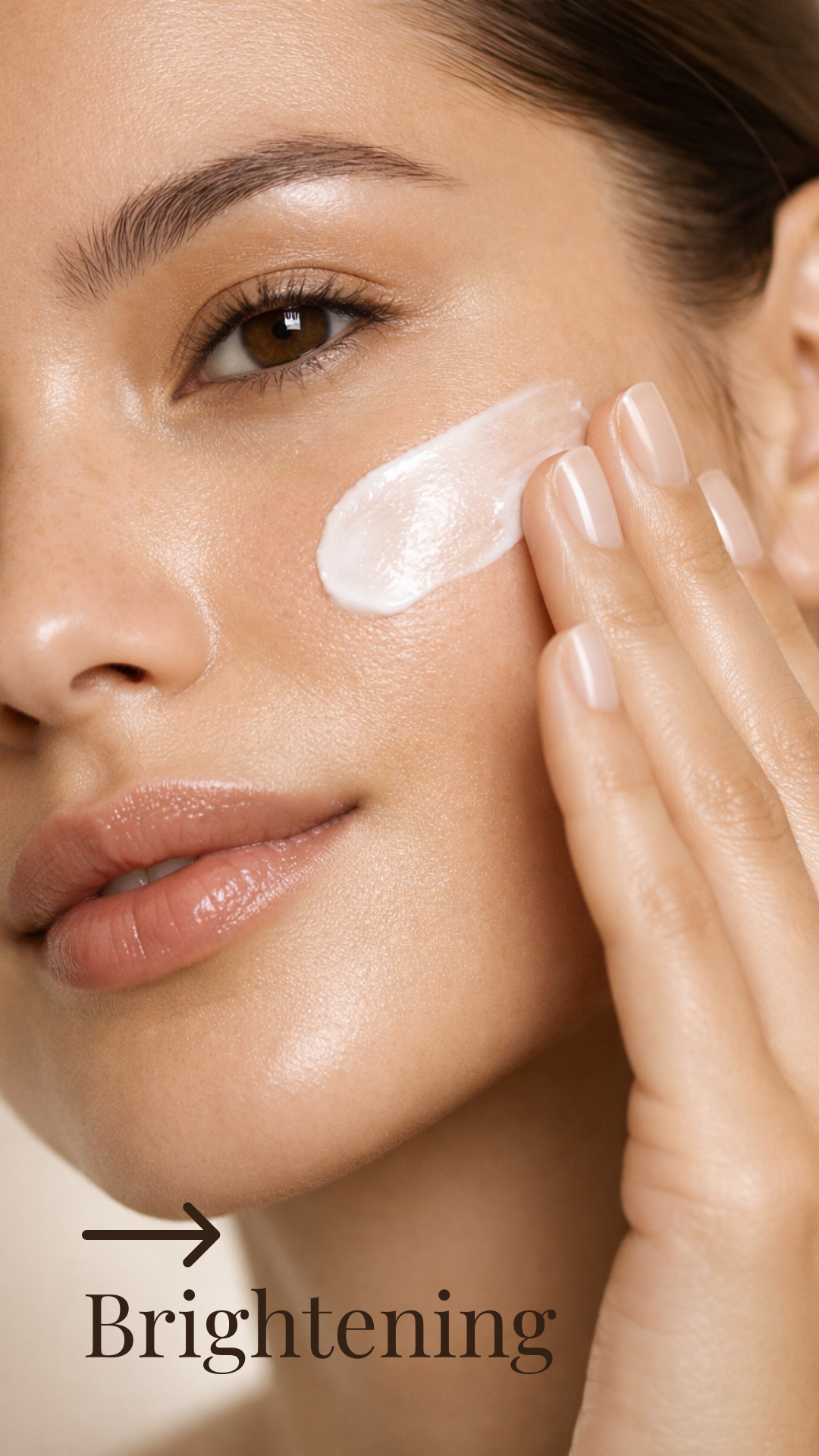 Close-up of a woman applying brightening cream to her cheek, with the word 'Brightening' and an arrow pointing to the cream.