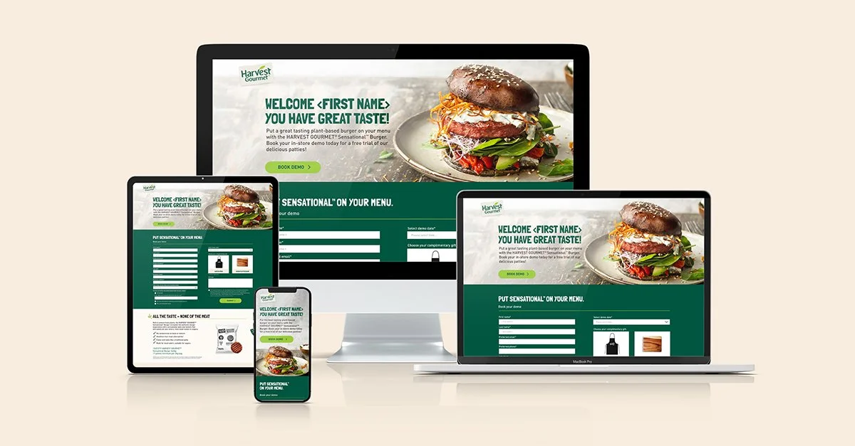 Multiple electronic devices displaying a website for Harvest Gourmet with a burger and text about tasting plant-based burgers.