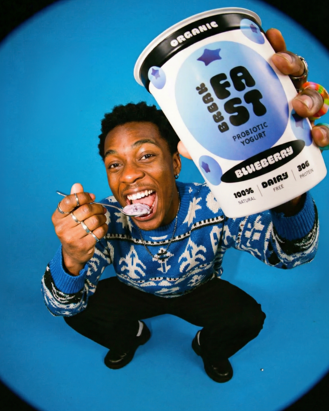 A woman wearing a pink shirt and black hat smiling and pulling on her hat. Behind her, a yellow background with black text reads 'smart money'. The image appears to be part of a social media post from 'flowmoney'.