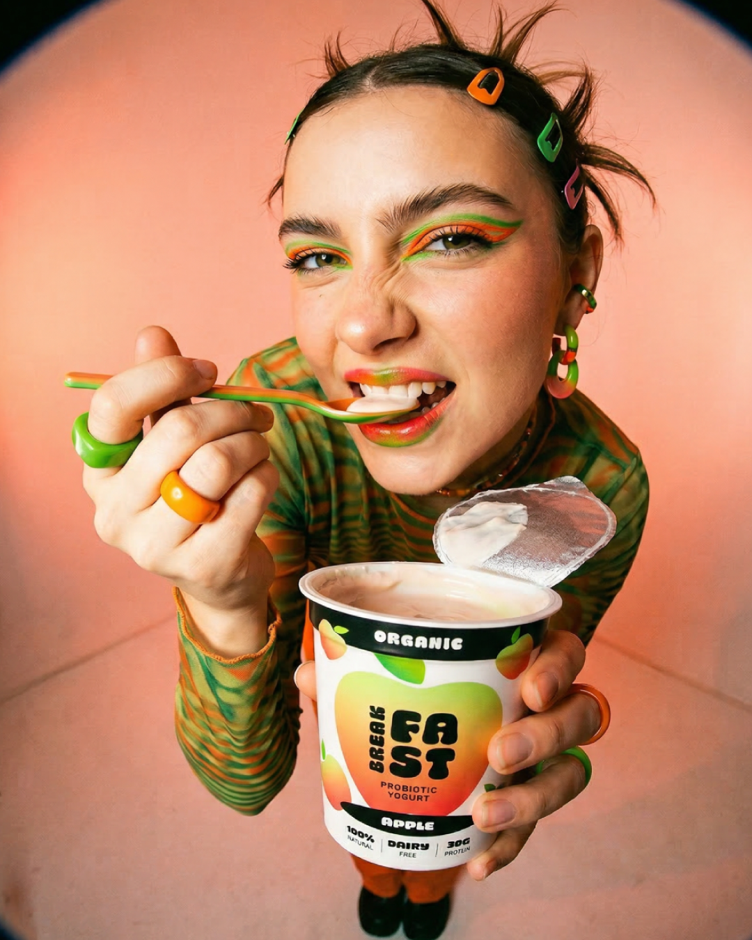 Pattern of the word 'FLOW' repeatedly displayed in pink, yellow, and blue on a black background, with a stylized infinity symbol replacing the letter 'O'.