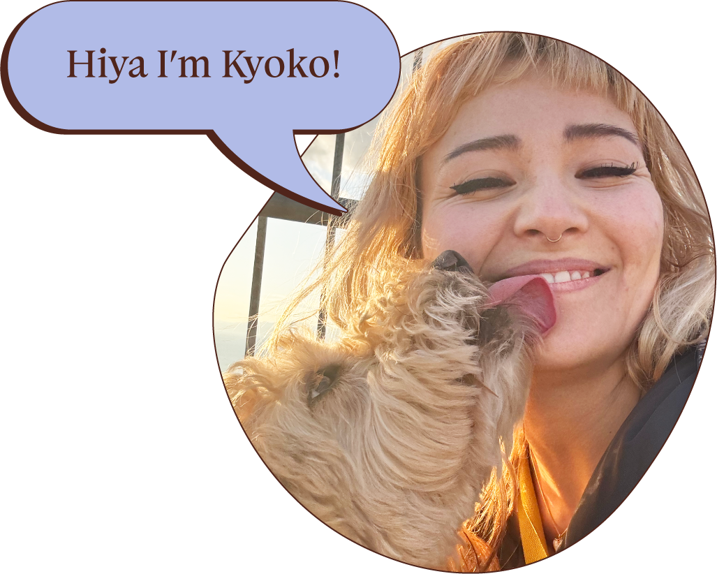 A woman with blonde hair and a nose ring smiles as her dog licks her face. A speech bubble says, 'Hiya I'm Kyoko!'