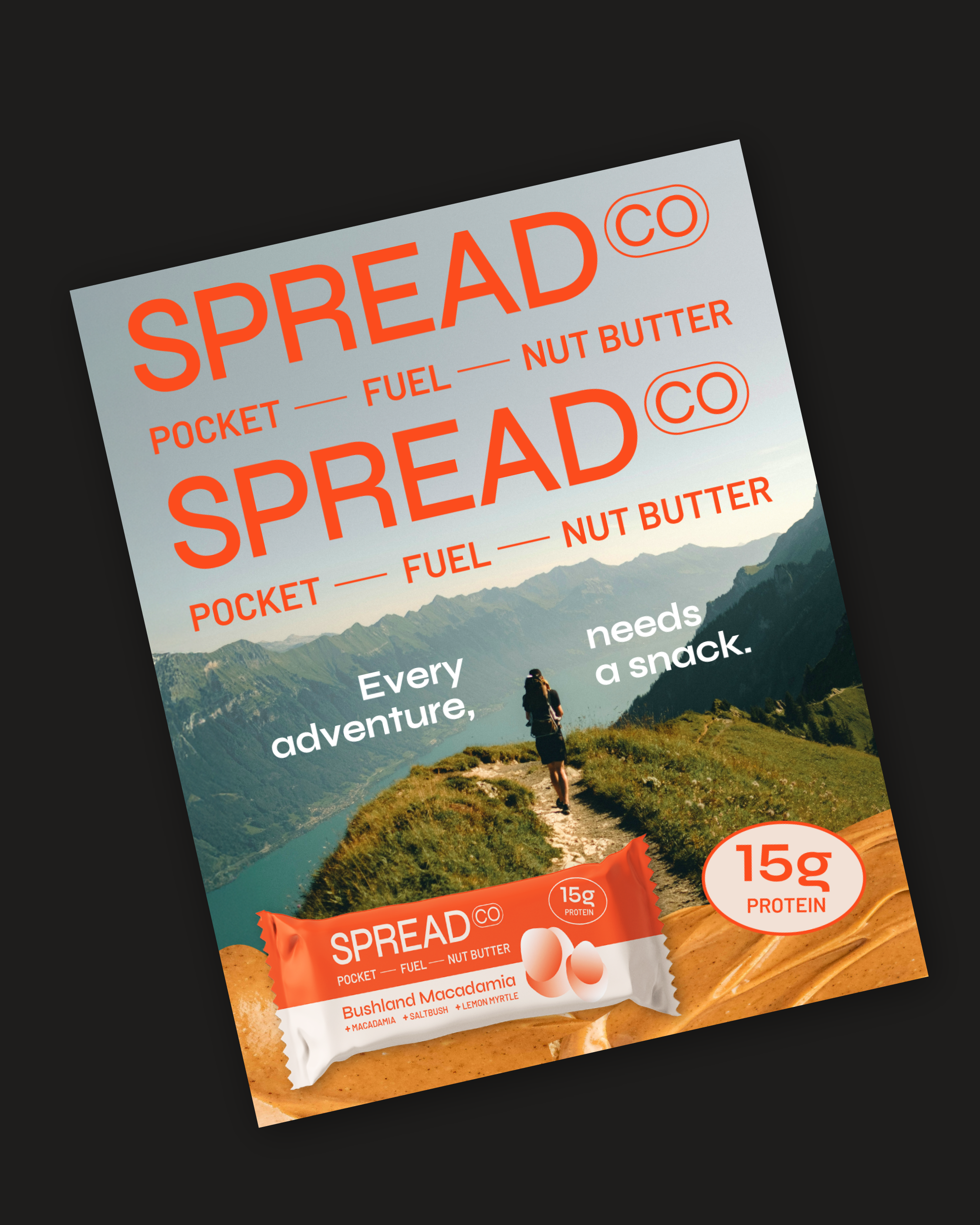 A magazine cover featuring a person hiking in mountains, promoting Spread Co's snack bars with flavors like Bushland Macadami and packed with 15 grams of protein, emphasizing adventure and nourishment.