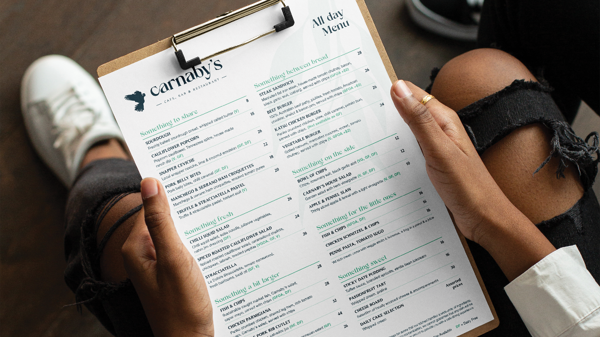 Multiple menu banners for Little Dimple restaurant, including a large red banner with white text repeating 'MENU' four times, and smaller white and green menus listing dishes like hot dumplings, little sides, and cocktails.