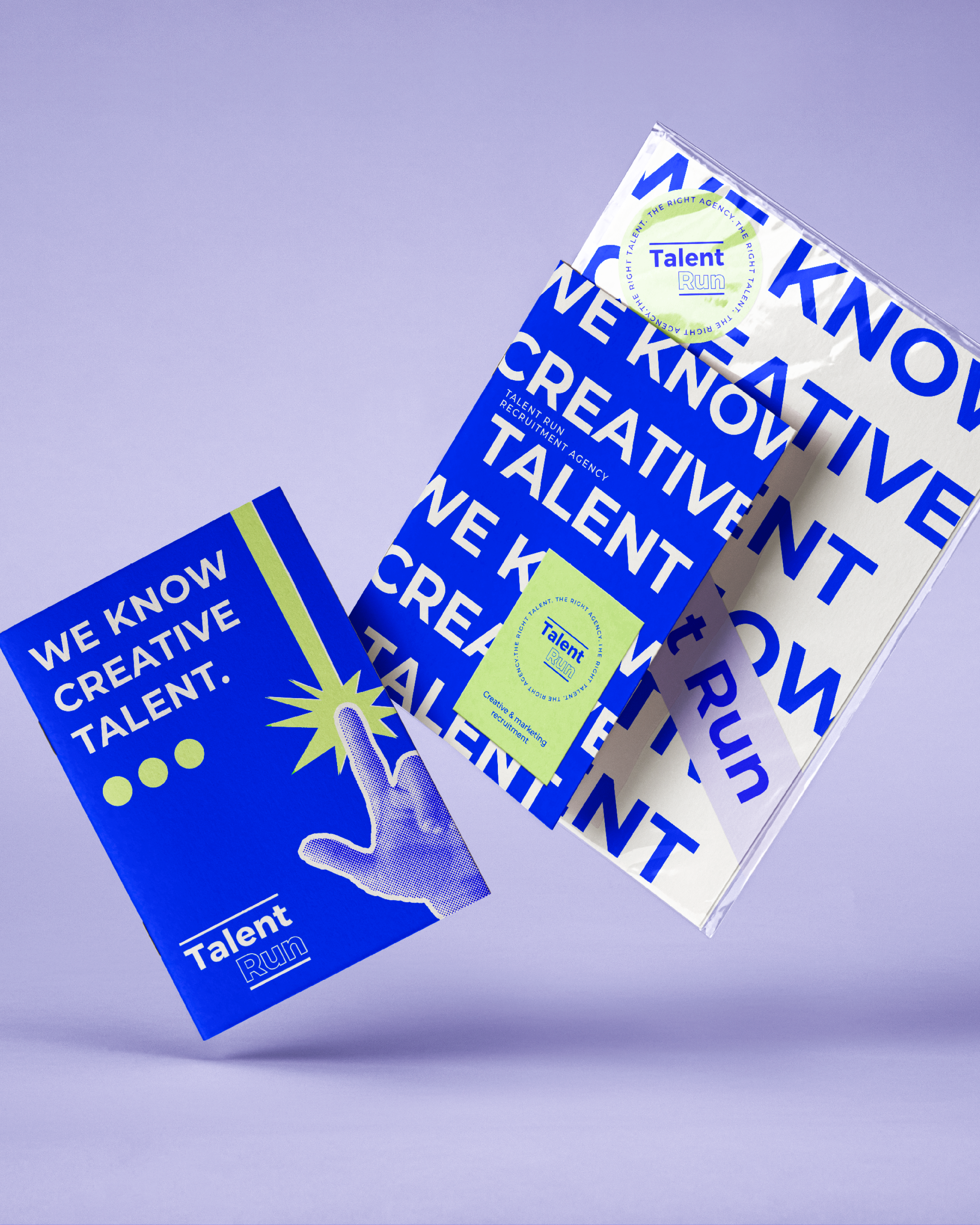 Promotional display with blue and green branding for Talent Run, featuring posters and brochures about creative talent recruitment.