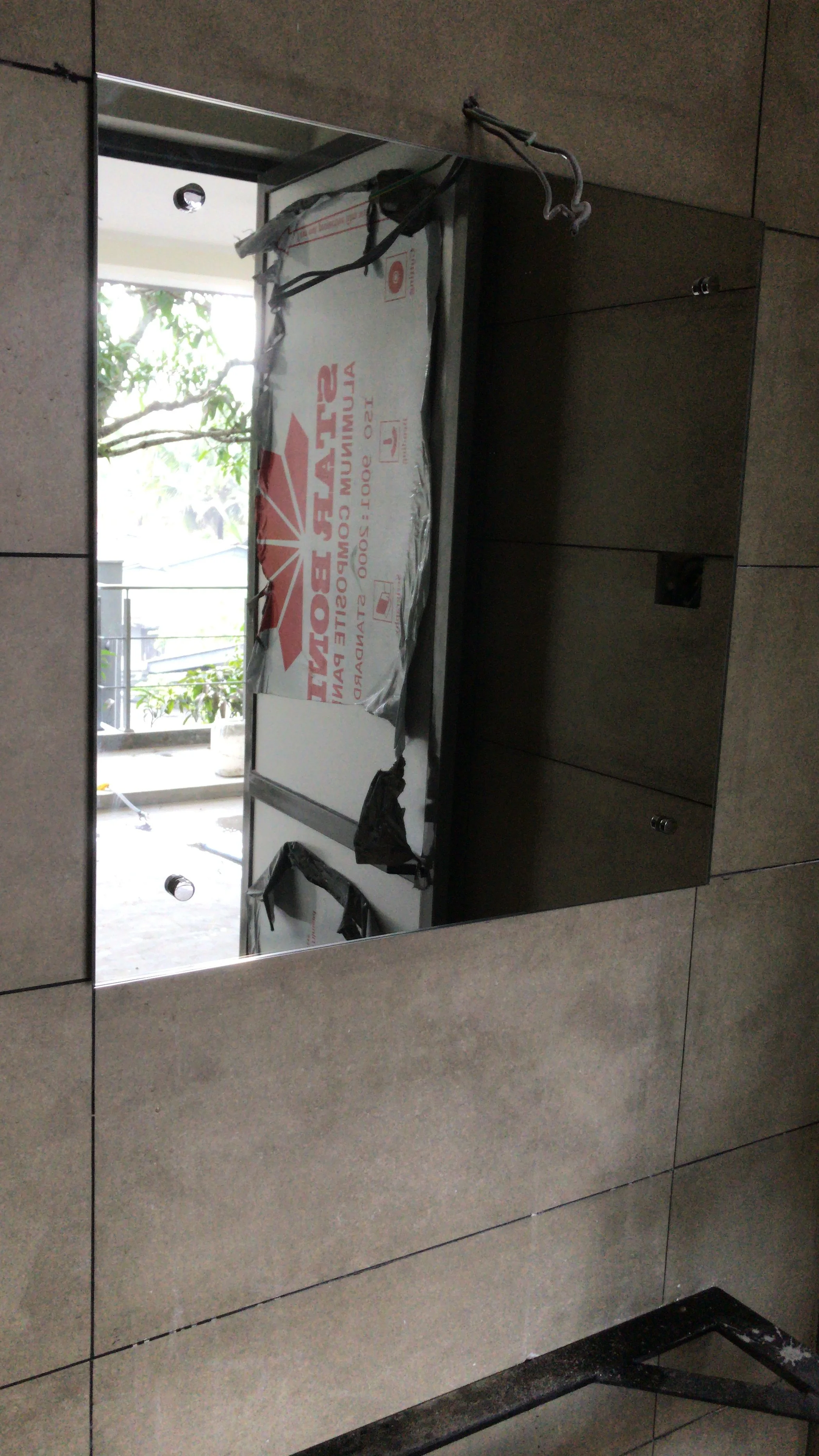 Bathroom Mirror installation with stainless steel capscrews