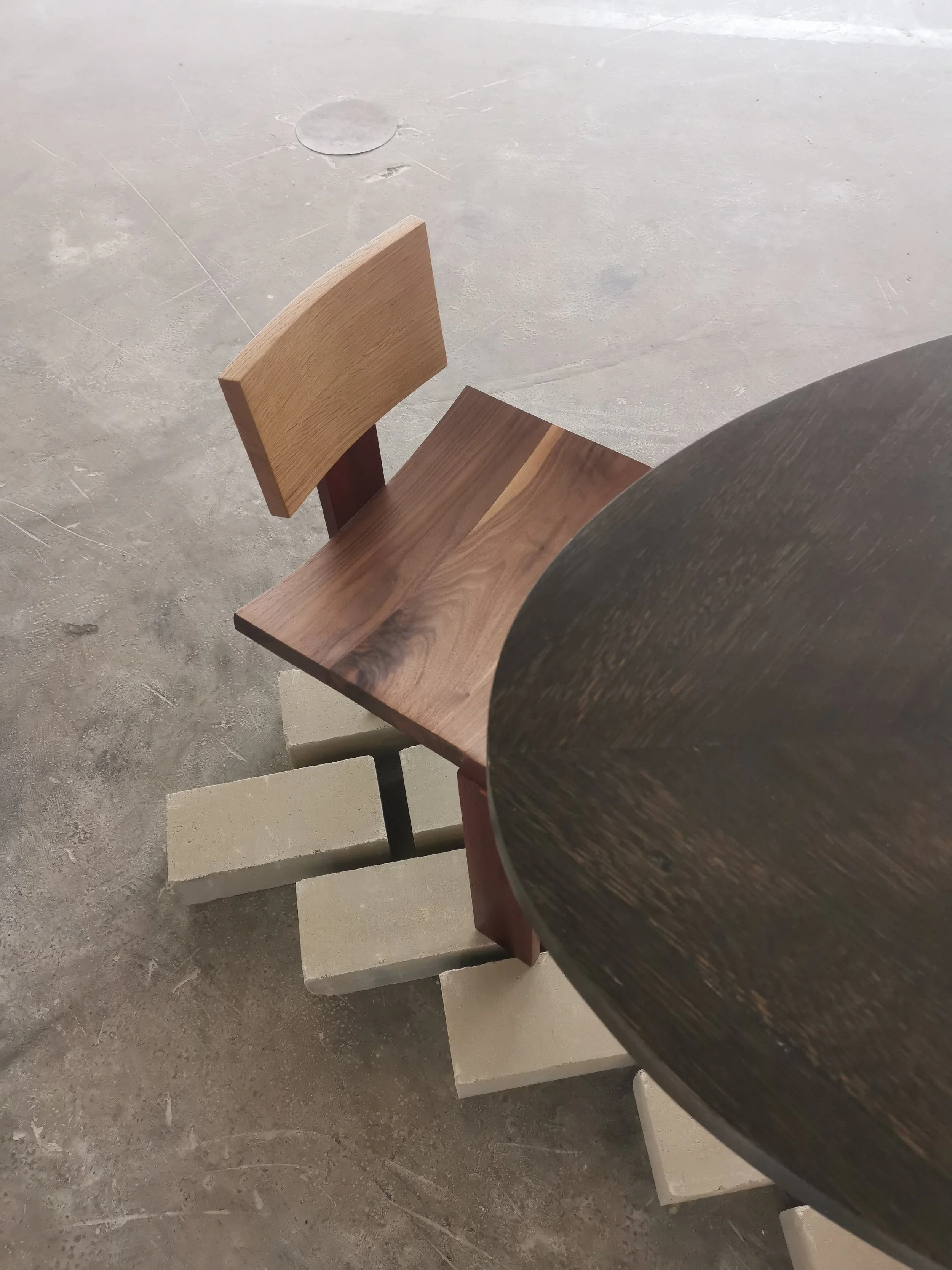 
The Continental Chair is crafted from reclaimed wood sourced exclusively from Mechelen, a city with a rich heritage in furniture. The materials, ranging from European oak to American walnut and African padoek, symbolize a fusion of worldwide origins