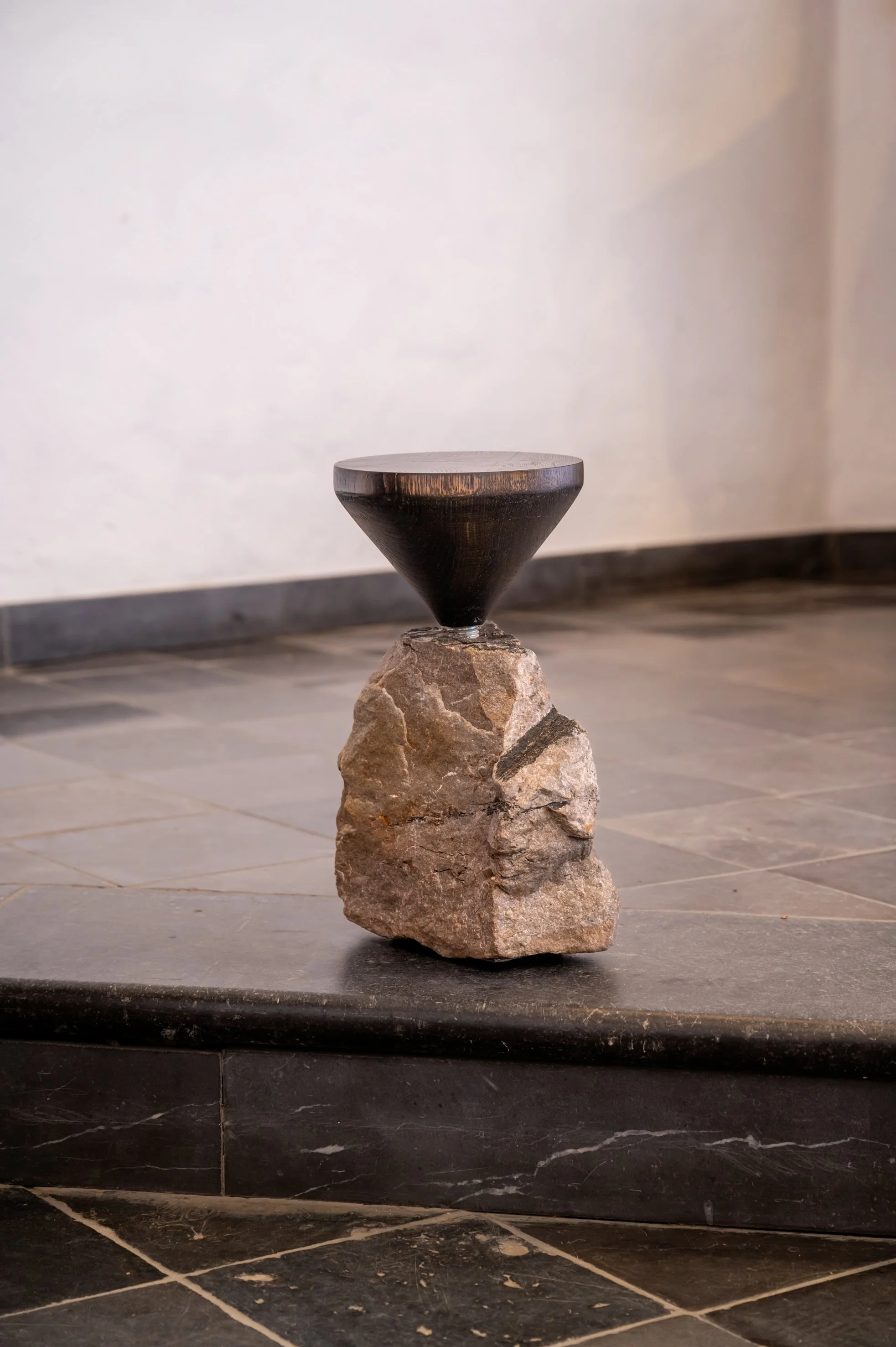 The sculptural collection, named "Zwart Goud," features a stone sourced from the coal mine of Houthalen, the birthplace of designer Dries Truyers.

The mine stone symbolizes the history of the coal mining industry and its consequences, representing a