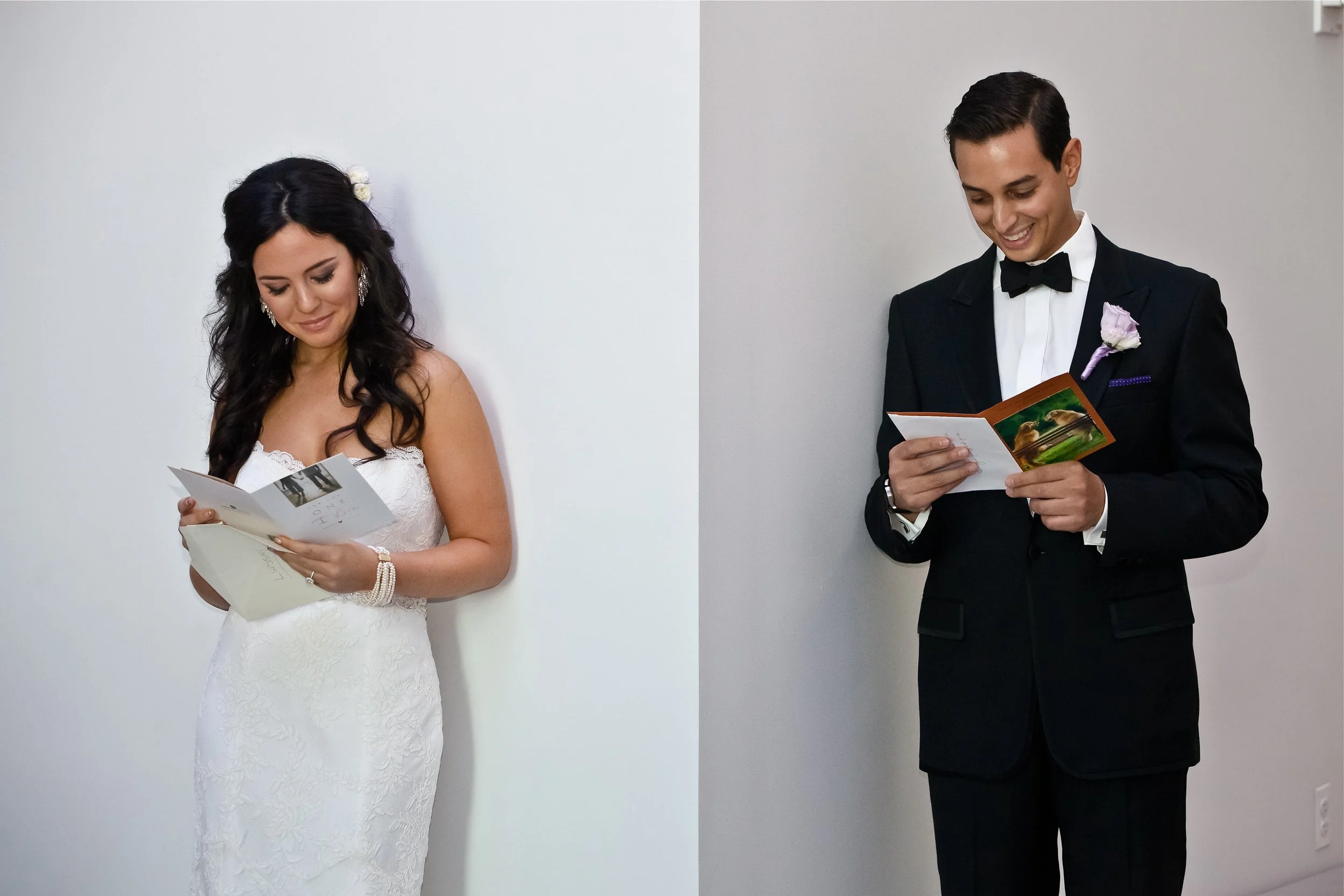 Bride and groom reading cards at their wedding.