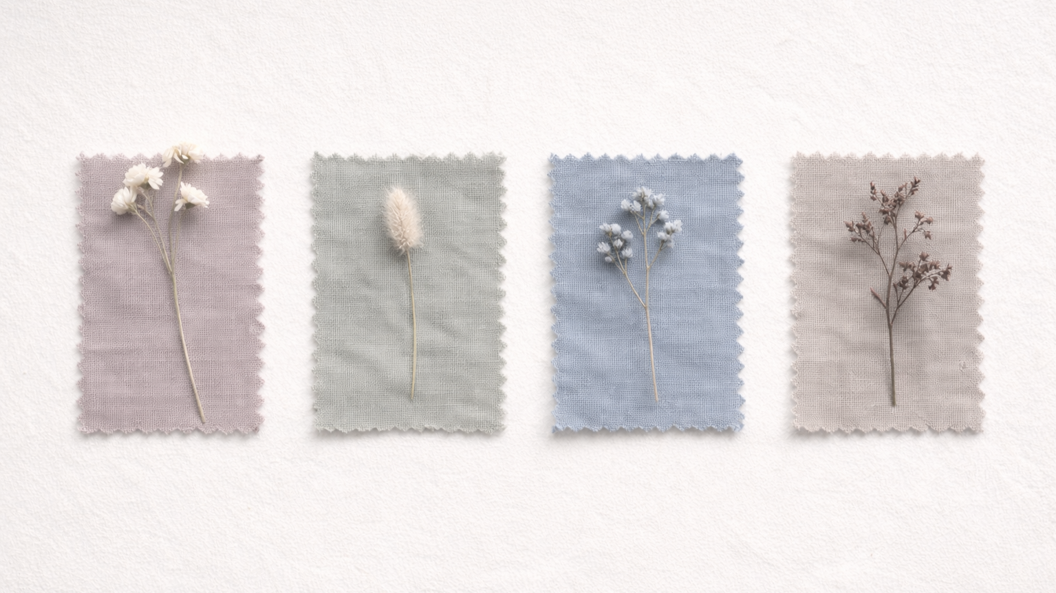 Four small wrapped fabric cards with dried flowers on each, arranged in a row on a white background.