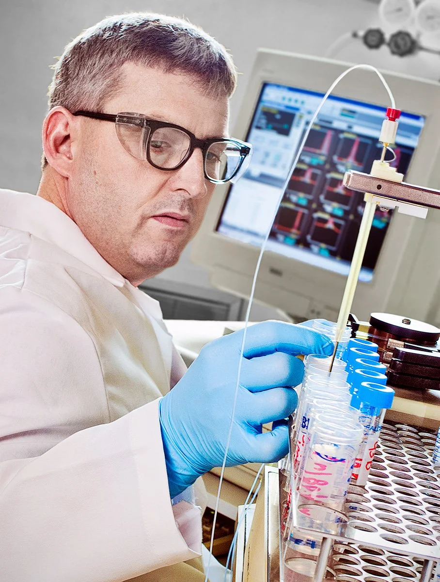 A labratory technician testing product samples in a manufacturing plant lab.
