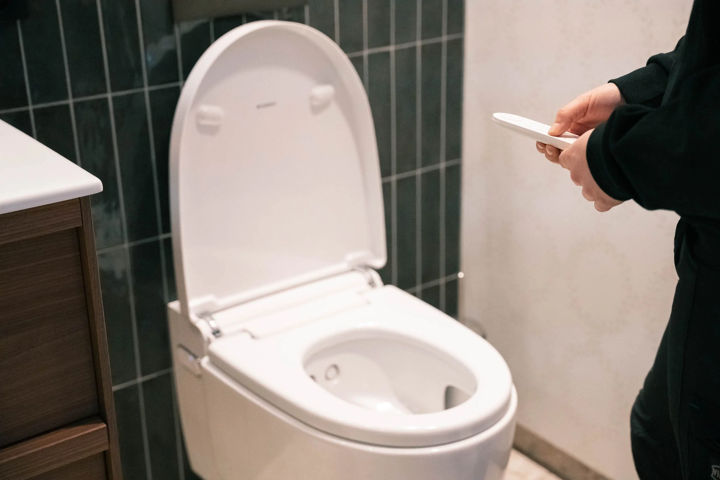 Nærbilde av baderomsdetaljer som viser kvalitet i arbeidet fra K. Lund