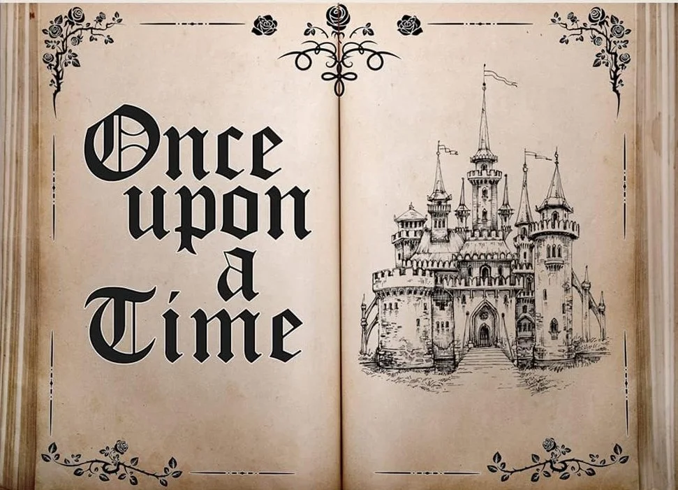 An illustrated open book with the words "Once upon a Time" in large, decorative font on the left page and a detailed sketch of a medieval castle on the right page, with floral corner decorations.