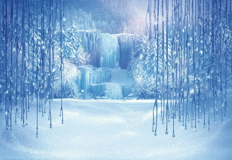 A snowy winter scene with ice-covered trees, a frozen waterfall, and a snow-covered ground.