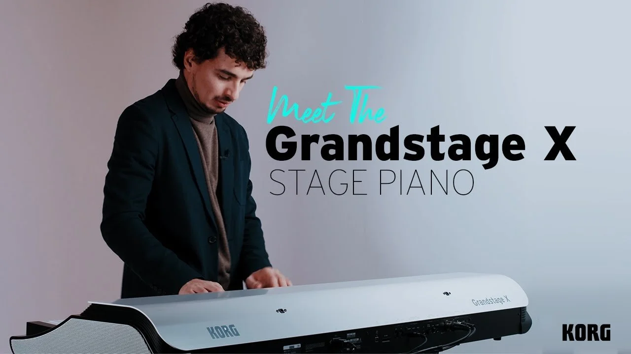 A man in a dark blazer and turtleneck playing a Grandstage X stage piano against a plain gray background, with text overlay that says "Meet The Grandstage X Stage Piano" and a KORG logo at the bottom right corner.