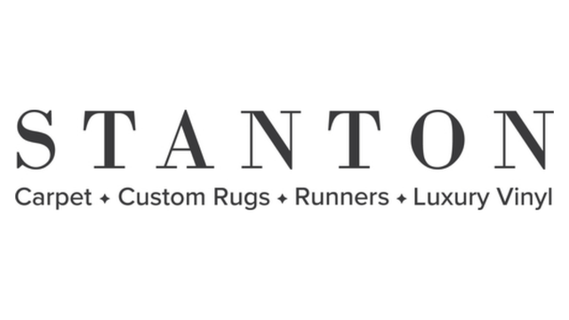Logo for Stanton, a company specializing in carpet, custom rugs, runners, and luxury vinyl flooring.