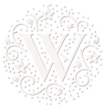 A decorative black and white design with a large letter 'W' in the center, surrounded by floral and swirl patterns.